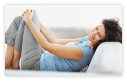 The Relaxation Academy - Lady shown relaxing and happy